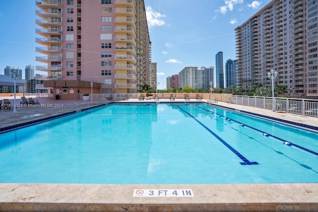 view of swimming pool with a patio area