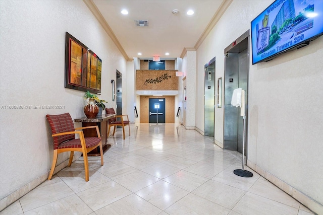 hall featuring ornamental molding and elevator