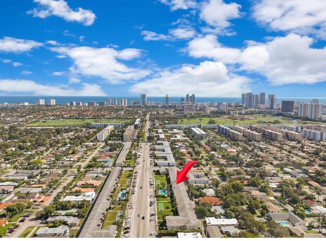 birds eye view of property with a view of city