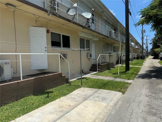 view of building exterior featuring ac unit