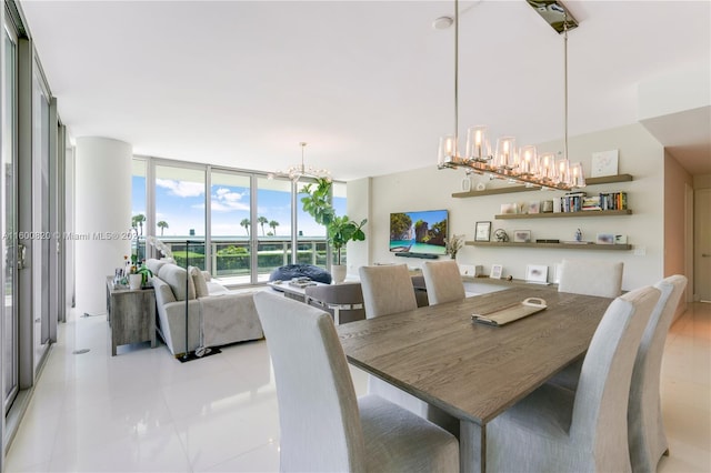 dining area featuring a notable chandelier, light tile flooring, and expansive windows