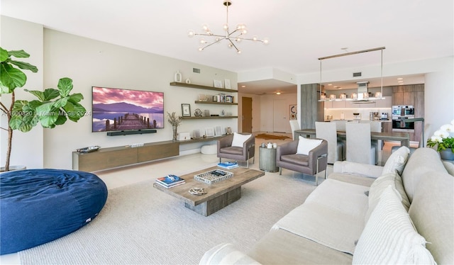 carpeted living room featuring an inviting chandelier