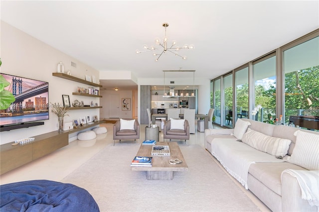 tiled living room featuring a notable chandelier and floor to ceiling windows