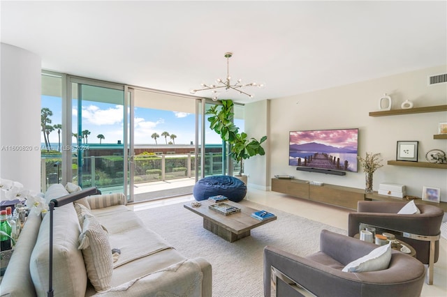 tiled living room featuring a wall of windows and an inviting chandelier