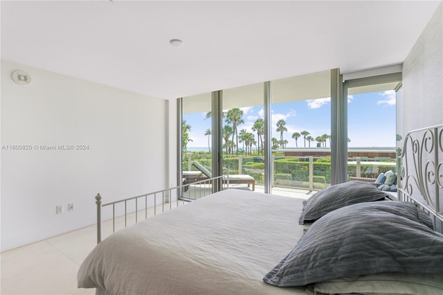 tiled bedroom with floor to ceiling windows