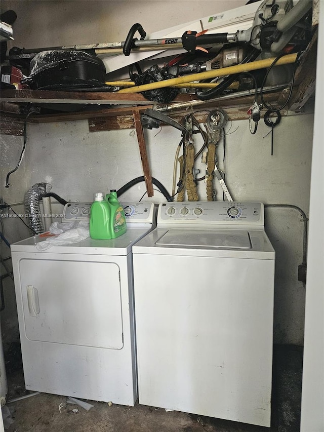 clothes washing area featuring laundry area and separate washer and dryer