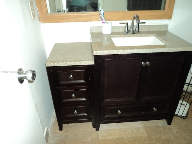 bathroom with tile flooring and oversized vanity