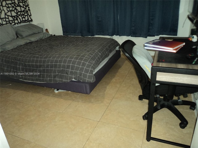 bedroom with tile flooring