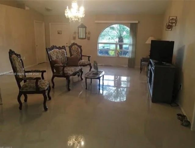 living room with a notable chandelier