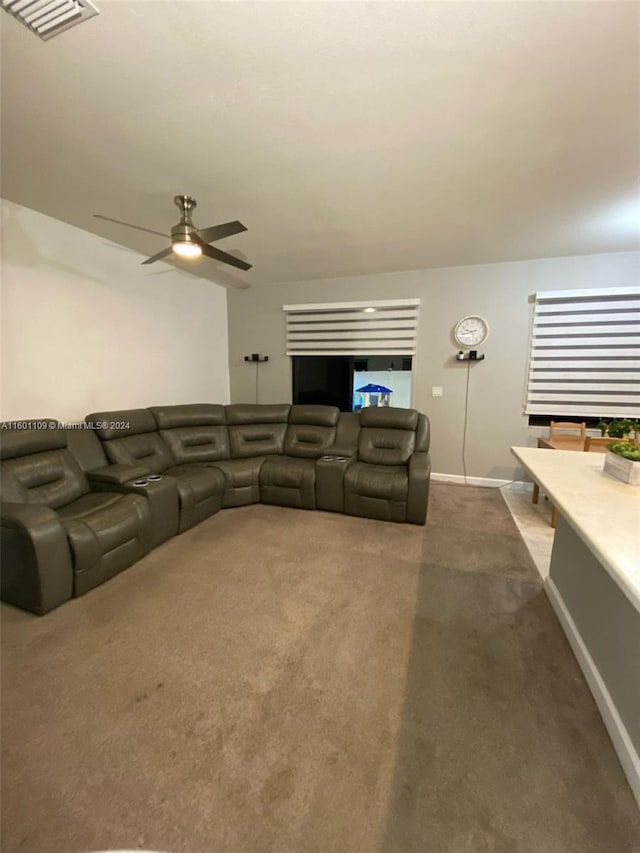 living room with carpet floors and ceiling fan