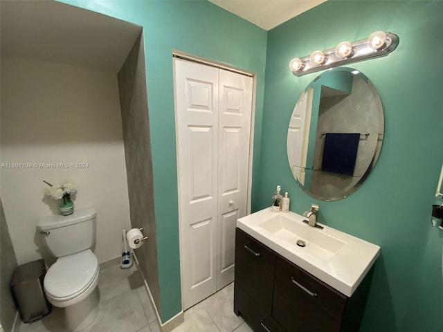 bathroom with tile patterned floors, vanity, and toilet