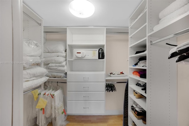 walk in closet featuring light hardwood / wood-style floors