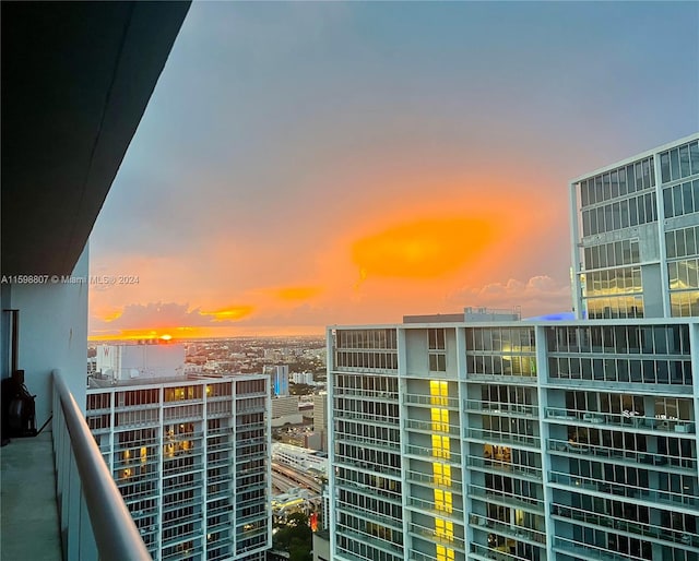 view of balcony at dusk