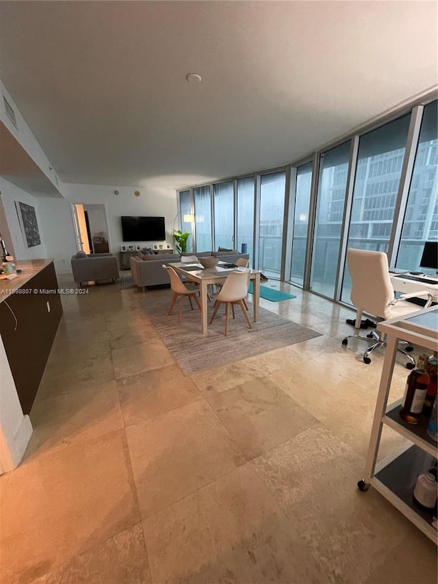 dining room featuring floor to ceiling windows