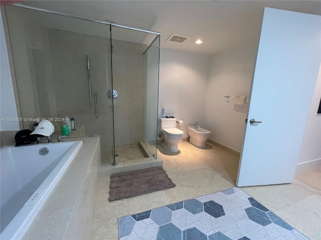 bathroom featuring a bidet, toilet, shower with separate bathtub, and tile patterned floors