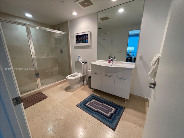 bathroom with tile patterned flooring, toilet, an enclosed shower, and vanity