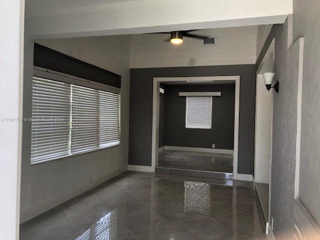 entrance foyer with ceiling fan