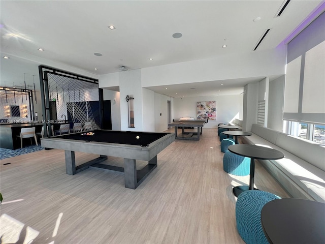 playroom with light hardwood / wood-style floors and pool table