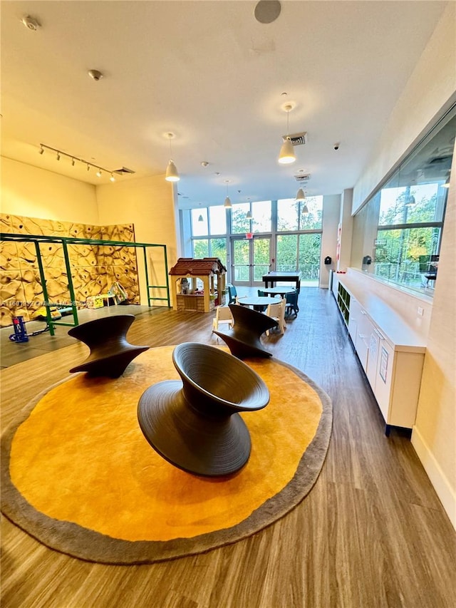 dining room with expansive windows, dark wood-type flooring, and billiards