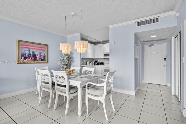 dining space featuring a textured ceiling, light tile patterned flooring, and crown molding