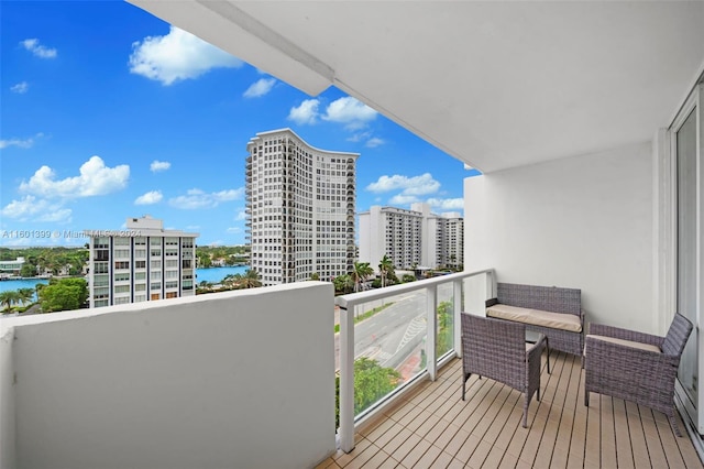 balcony with a city view and a water view