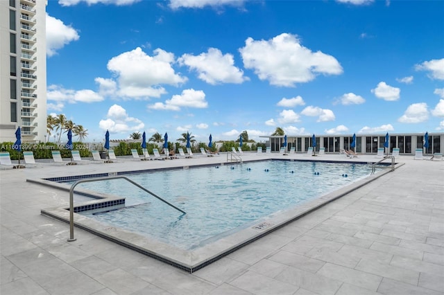 view of swimming pool featuring a patio