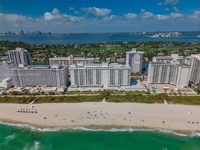 aerial view with a beach view and a water view