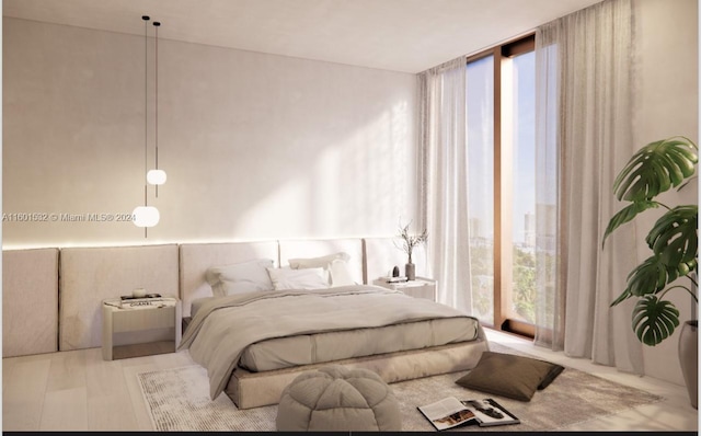 bedroom featuring multiple windows and floor to ceiling windows