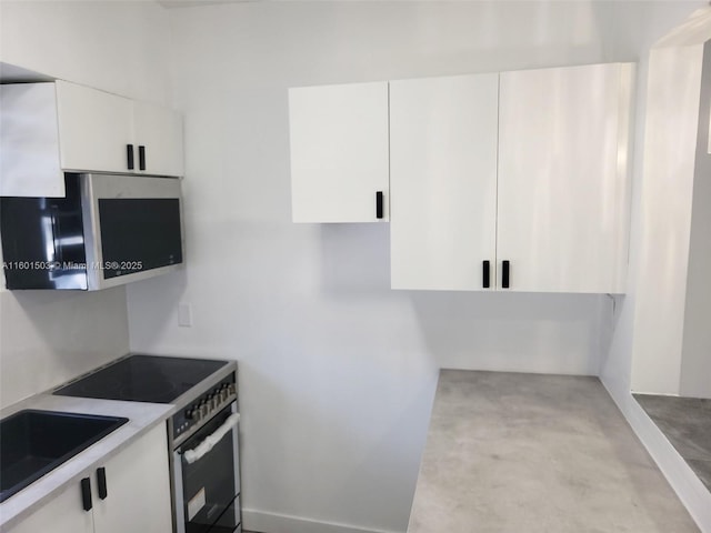 kitchen featuring sink, white cabinets, and appliances with stainless steel finishes