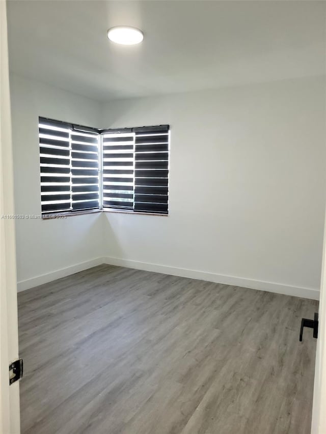 spare room featuring light wood-type flooring