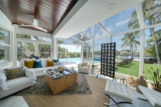 sunroom / solarium with a water view, lofted ceiling, and wood ceiling