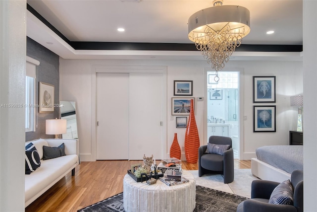 living room featuring a chandelier and wood-type flooring