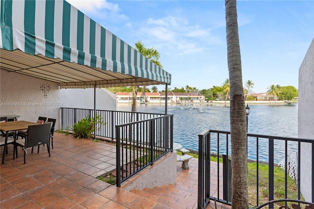 view of patio featuring a water view