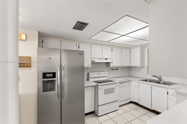 kitchen with sink, white cabinets, white appliances, and light tile floors