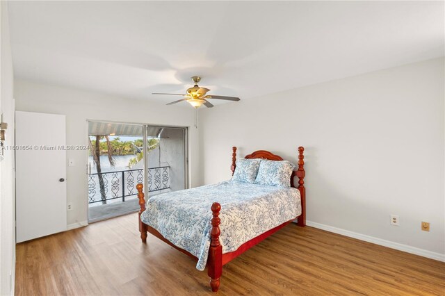 bedroom featuring wood-type flooring, ceiling fan, and access to exterior