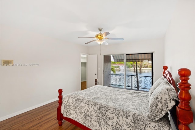 bedroom with wood-type flooring, a water view, ceiling fan, and access to outside