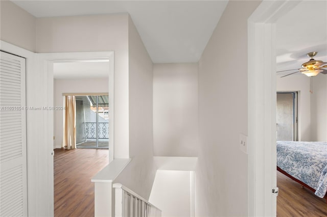 corridor with hardwood / wood-style floors