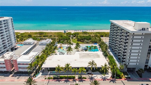 bird's eye view featuring a view of the beach and a water view