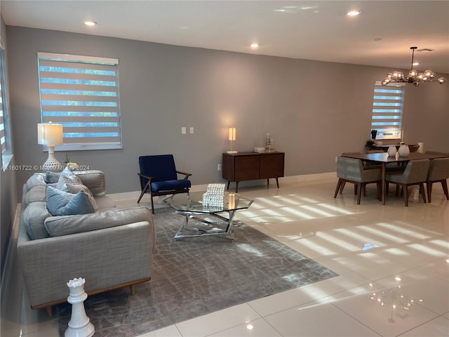 living room featuring tile patterned floors and a chandelier