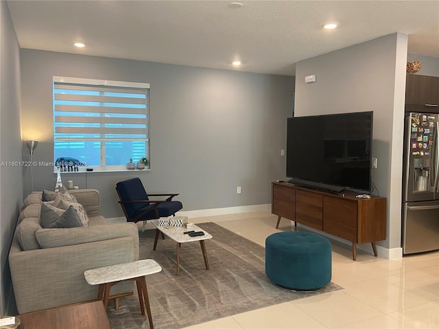 living area featuring light tile patterned floors, baseboards, and recessed lighting