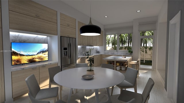 dining space featuring light hardwood / wood-style floors