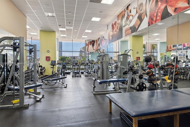 workout area featuring a paneled ceiling