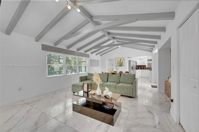 living room with lofted ceiling with beams