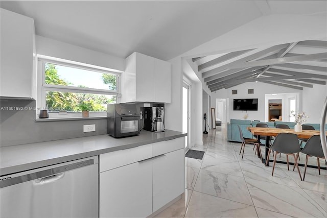 kitchen featuring modern cabinets, lofted ceiling with beams, marble finish floor, white cabinetry, and dishwasher