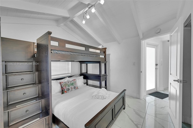 bedroom with lofted ceiling with beams and marble finish floor