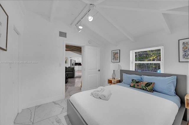 bedroom with marble finish floor, visible vents, vaulted ceiling with beams, and track lighting