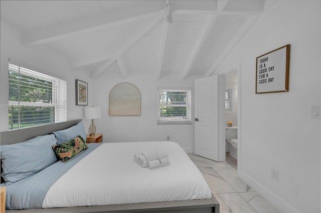 bedroom featuring ensuite bathroom, lofted ceiling with beams, and marble finish floor