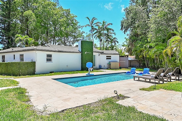 view of pool with fence, a fenced in pool, and a patio area