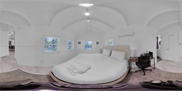 bedroom with a wall mounted air conditioner, lofted ceiling, and marble finish floor