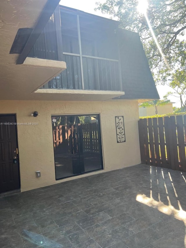 entrance to property featuring a balcony